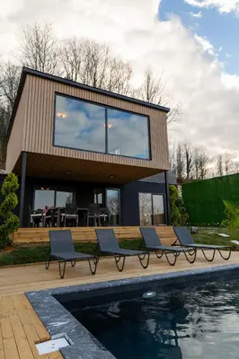 a house with a swimming pool in front of it at PANA Sapanca Lake View in Sapanca