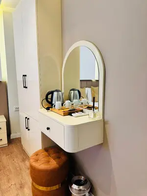 a bathroom with a vanity with a mirror at Garden Elisa Hotel in Istanbul