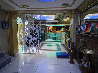 a kitchen with a table in the middle of a room at Falay Hotel Yavuz in Istanbul