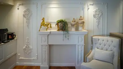 a white room with a white table and a chair at Gaia Suites Istanbul in Istanbul