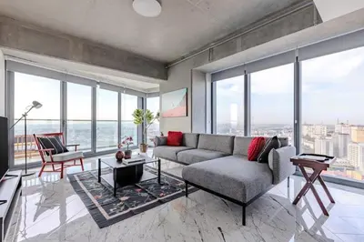 a living room with a couch and large windows at Beautiful Elegant 1BD Private Terrace Gem! #333 in Istanbul
