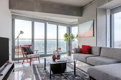 a living room with a couch and a table at Beautiful Elegant 1BD Private Terrace Gem! #333 in Istanbul