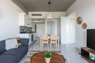 a living room with a couch and a table at Beautiful Bright 2Bed - ParkingPoolTerrace! #341 in Istanbul