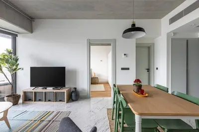 a living room with a dining table and a flat screen tv at Elegant 1BD Terrace Gem PoolParking! #344 in Istanbul