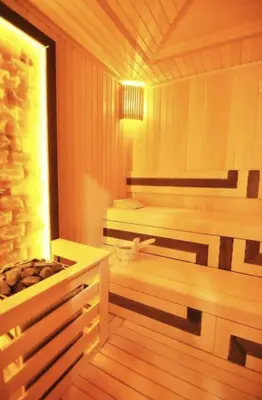 a sauna with two benches and a window at Elegant 1BD Terrace Gem PoolParking! #344 in Istanbul