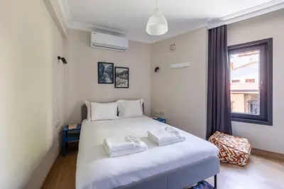 a bedroom with a bed with two towels on it at Stunning Bosphorus 2BD2Bath Views Terrace! #357 in Istanbul