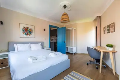 a bedroom with a bed and a desk and a computer at Gorgeous Airy 2BD2Bath Bosphorus Views! #358 in Istanbul