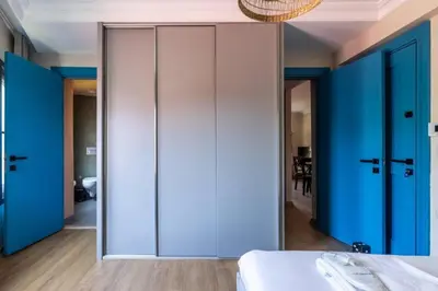 a bedroom with blue and white walls and a bed at Gorgeous Airy 2BD2Bath Bosphorus Views! #358 in Istanbul