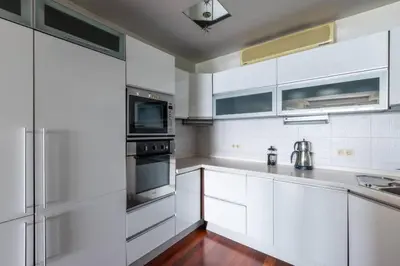 a kitchen with white cabinets and stainless steel appliances at Gorgeous Bright 2Bed1Bath Bosphorus Views! #356 in Istanbul
