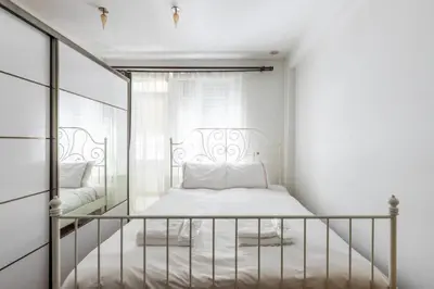 a white bedroom with a bed and a window at Gorgeous Bright 2Bed1Bath Bosphorus Views! #356 in Istanbul
