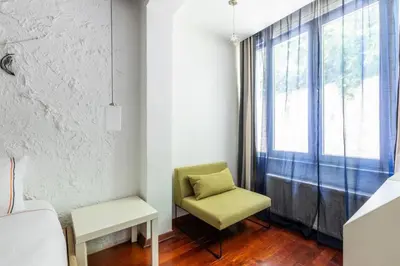 a living room with a chair and a window at Gorgeous Bright 2Bed1Bath Bosphorus Views! #356 in Istanbul