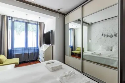 a bedroom with a mirror and a bed and a tv at Gorgeous Bright 2Bed1Bath Bosphorus Views! #356 in Istanbul