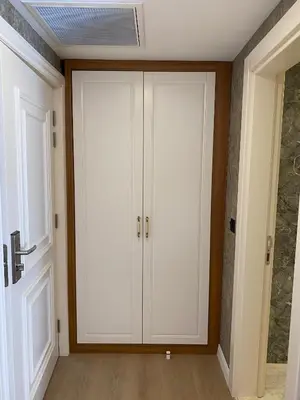 a room with white cabinets and a door at By Otel Nilüfer in Bursa