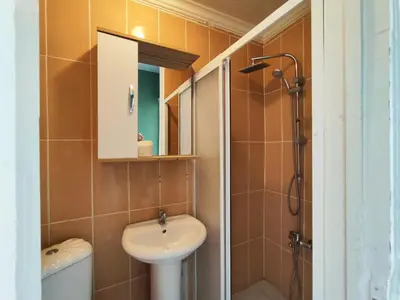 a bathroom with a sink and a toilet and a mirror at Sweet Home in Istanbul