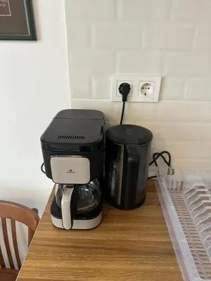a coffee maker sitting on top of a table at Yellowhouse Room 6 in Istanbul
