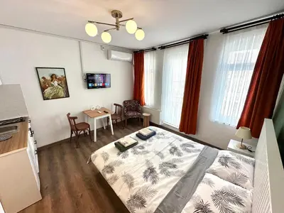 a bedroom with a bed and a table in it at Yellowhouse Room 6 in Istanbul