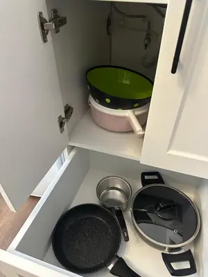 a kitchen with a pot and a pan in a drawer at Yellowhouse Room 3 in Istanbul