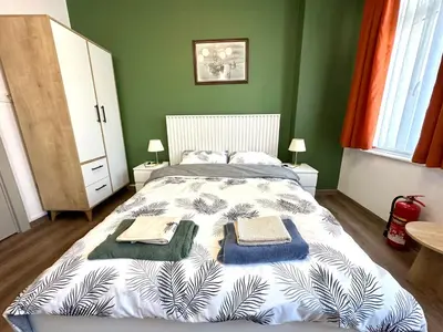 a bedroom with a bed with towels on it at Yellowhouse Room 3 in Istanbul