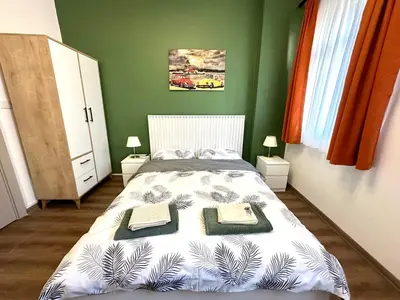 a bedroom with a bed with two towels on it at Yellowhouse Room 2 in Istanbul