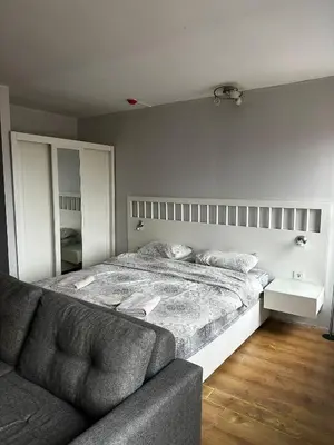 a bedroom with a large bed and a couch at D&D Pansiyon in Istanbul