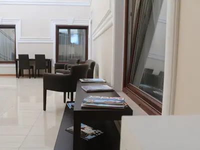 a waiting room with chairs and tables in a building at Helenapolis OTEL in Yalova