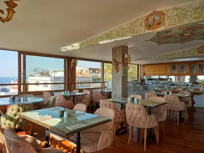 a restaurant with tables and chairs with a view at 1207 Hotel Special Class Sultanahmet in Istanbul