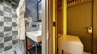 a bathroom with a sink and a door at Wonder House Sultanahmet in Istanbul