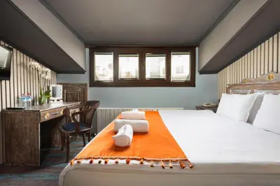 a bedroom with a bed with two towels on it at Wonder House Sultanahmet in Istanbul