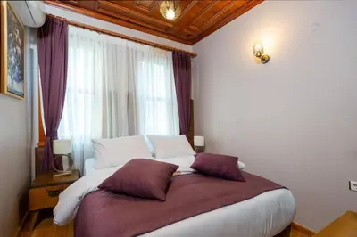 a bedroom with a large bed in front of a window at Wonder House Sultanahmet in Istanbul