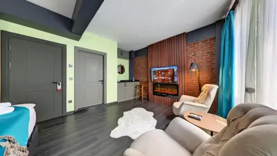 a living room with a couch and a tv at Wonder House Sultanahmet in Istanbul