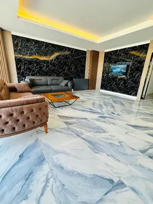 a living room with a large marble floor at The Hera Gold Hotel in Istanbul