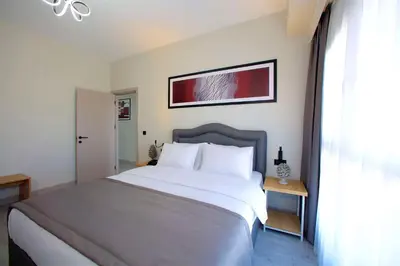 a bedroom with a large white bed and a window at Best Western Plus Hotel & Residences Istanbul in Istanbul