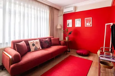 a red living room with a red couch at AKA Home in Istanbul