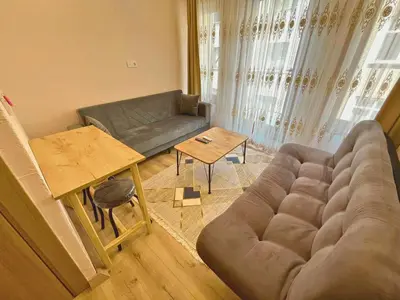 a living room with a couch and a table at Dila Apart Hotel in Istanbul