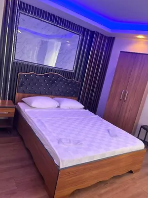 a bedroom with a bed with a large window at Hisar Çeşme Hotel in Istanbul