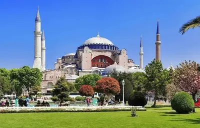 a large building with two mosques with a green park at Bro Apartments Sultanahmet in Istanbul