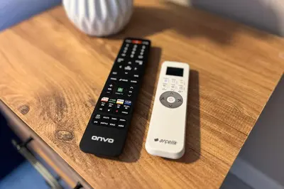 two remote controls sitting on top of a table at Bro Apartments Sultanahmet in Istanbul