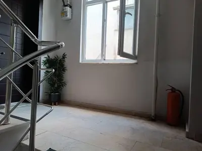an empty room with a window and a staircase at Taksim Dora Apart in Istanbul