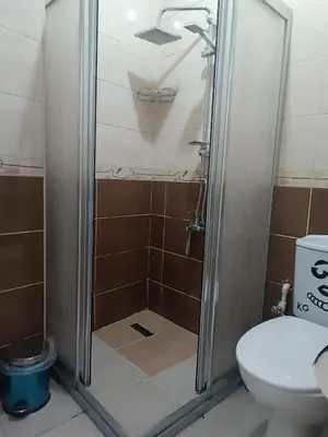a shower stall in a bathroom with a toilet at Taksim Dora Apart in Istanbul