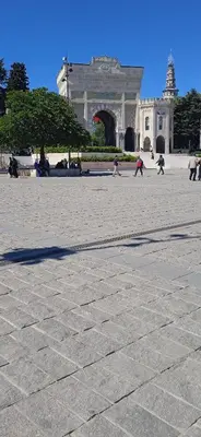 a group of people walking around a large building at Yellow Bull Istanbul hotel in Istanbul