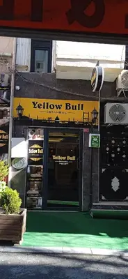 a yellow building with a yellow bill sign on it at Yellow Bull Istanbul hotel in Istanbul