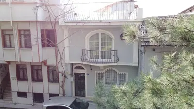 a house with a car parked in front of it at Cozy Duplex Next to Green Masjid in Yıldırım