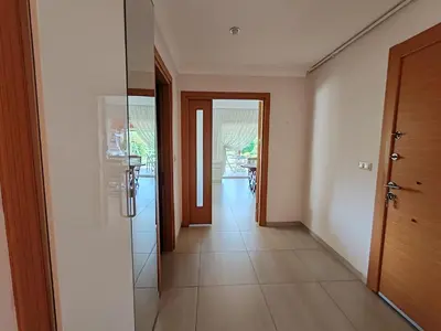 a hallway of a house with a door and a room at Garden Floor Flat in a Beachfront Complex with a Pool in Gümüşyaka