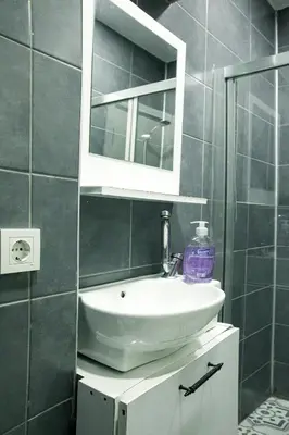 a bathroom with a sink and a mirror at Beans House Suite 8-26 in Istanbul