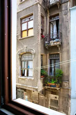 a reflection of a building in a window at Beans House Suite 8-26 in Istanbul