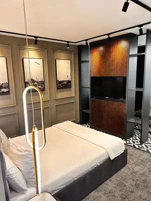 a bedroom with a bed and a flat screen tv at Zeytin Hotel in Istanbul