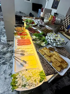 a buffet with many different types of food on a table at Crowned Exclusive Hotel in Istanbul