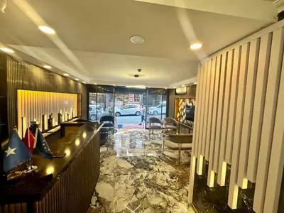 a lobby with a bar with a car parked at Crowned Exclusive Hotel in Istanbul