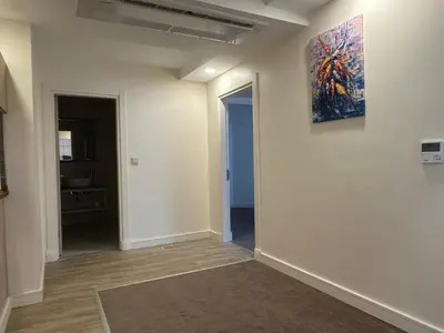 an empty room with a painting on the wall at Roys Hotel & Suites in Istanbul