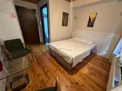a small bedroom with a bed and a chair at Hotel No 34 in Istanbul